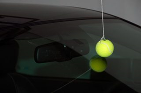 Tennis Ball hanging from a String