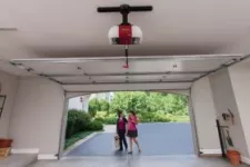 Children in front of an opened garage door