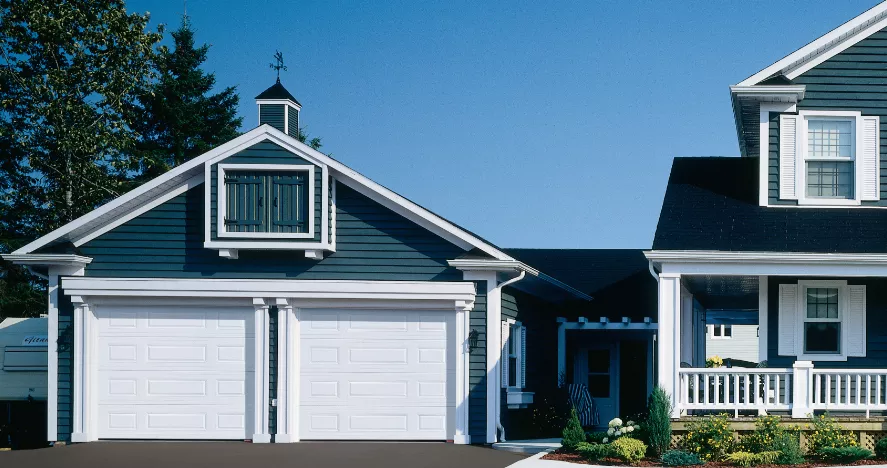 traditional home with garage doors